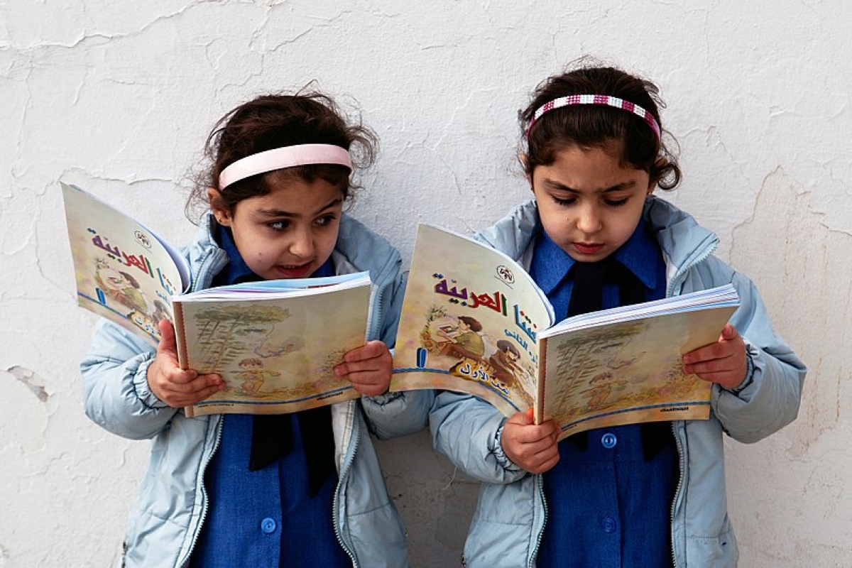 Two school girls reading in Amman, Jordan. Tanya Habjouqa [CC BY-SA 3.0-igo]
