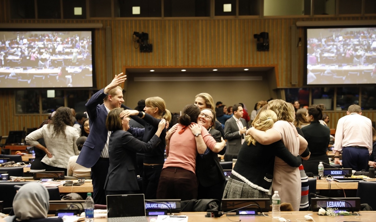 Delegates rejoicing over the adoption of the UNCSW63 Agreed Conclusions.